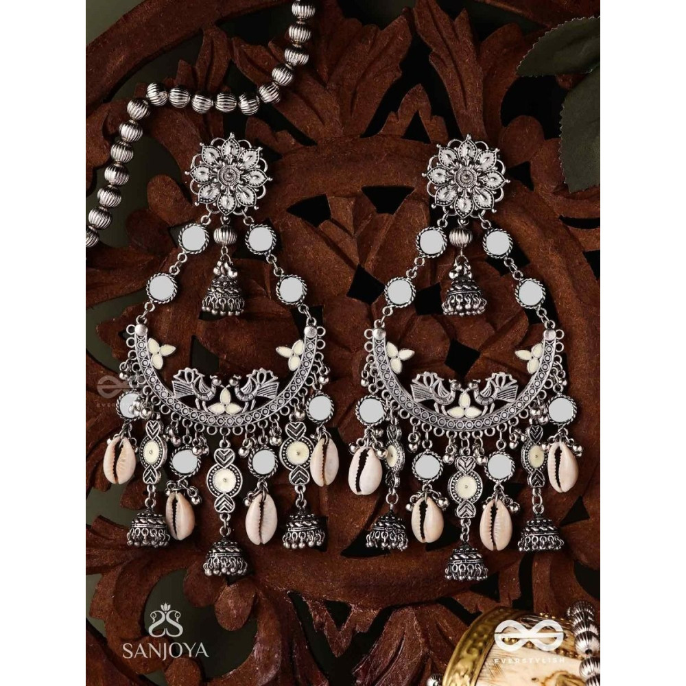 CHANDRAMAYURA- MOON-PEACOCK EARRINGS- OXIDIZED CHAANDBAALI EARRINGS, ADORNED WITH MIRRORS, GHUNGHROOS, COWRIE SHELLS, AND DANGLING JHUMKA